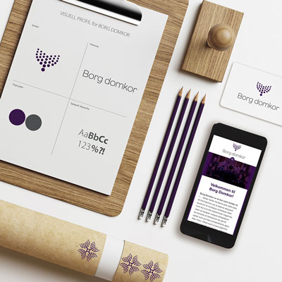 Bildet viser ulike medier med Borg Domkors profilelementer applisert.